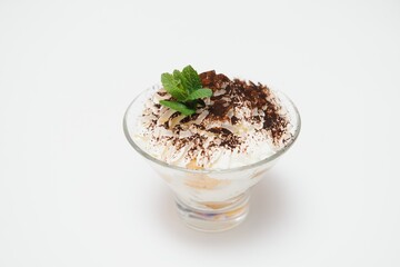 Tasty milk shake with chocolate topping on white background