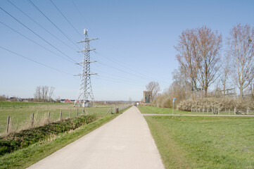 Fototapeta na wymiar Electricity pylon for transporting electricity with cables to a substation in Arnhem in the Netherlands