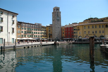 Naklejka premium Riva with a view of the Torre Apponale on Lake Garda; Italy; Dolomites