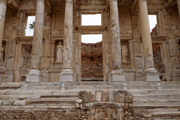 Fototapeta premium gate of Celsus Library and statues in Ephesus ruins, historical ancient Roman archaeological sites in eastern Mediterranean Ionia region