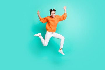 Fototapeta na wymiar Full size photo of optimistic nice brunet lady jump wear sweater jeans isolated on teal background