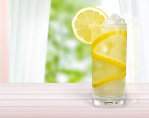 Lemonade with fresh slice lemon on desk