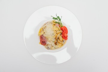 Pasta with meat, tomato sauce, parmesan and vegetables