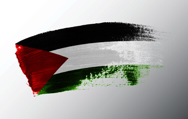 Palestine flag illustrated on paint brush stroke
