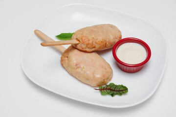 Delicious grilled pork ribs in BBQ sauce with herbs, isolated on white background