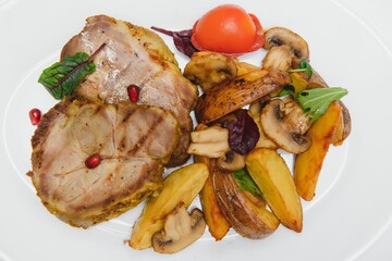 Delicious grilled pork ribs in BBQ sauce with herbs, isolated on white background