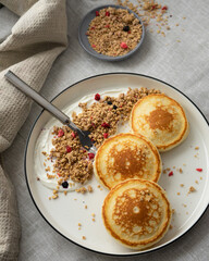 Fritters with granrolla and yoghurt for breakfast