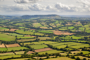 Fototapeta na wymiar View over patchwork fields of Herefordshire from Offa's Dyke Path on Hatterrall Hill, near Pandy, Monmouthshire, Wales, United Kingdom