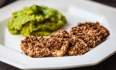 Fried tofu with sesame and pea, potato and mint puree.