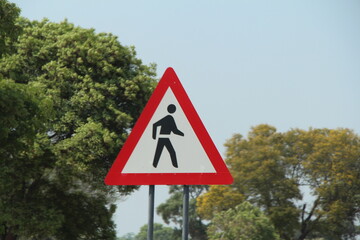 road sign in namibia, caution people