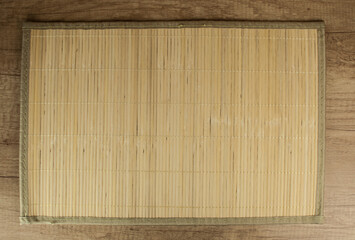 bamboo napkin on a dark wooden table, top view