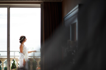 Fototapeta premium Tender wedding morning of a young bride. Portrait. 