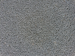 texture of interwoven plastic threads used in carpets