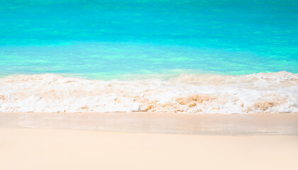 Fototapeta na wymiar Beautiful Turqouise waves on white sand beach.Tropcal vacation concept.