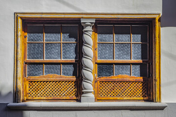 Typical Canary Island colourful architecture with wooden decorative elements on the island of Tenerife. San Cristobal de La Laguna, Tenerife, Canary Islands, Spain.
