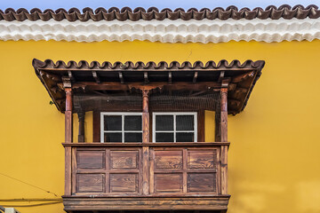 Typical Canary Island colourful architecture with wooden decorative elements on the island of Tenerife. San Cristobal de La Laguna, Tenerife, Canary Islands, Spain. © dbrnjhrj