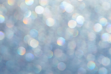 Obraz premium bright glitter background: bokeh effect from many colored lights on frozen glass, toning