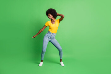 Fototapeta na wymiar Full length body size photo of dancing overjoyed girl spending free time relaxing isolated on bright green color background