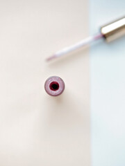 Open bottle of lip gloss