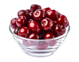 glass bowl of sweet cherry fruits isolated on white background