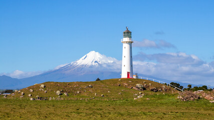 Fototapeta na wymiar Cape Egmont lighthouse and Mount Taranaki, North Island, New Zealand
