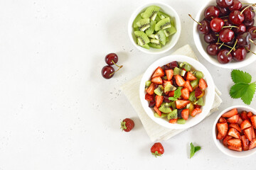 Fruit salad from kiwi and strawberry in bowl