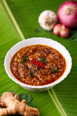 Injipuli , Puli Inji curry ginger pickle for Onam Sadhya Vishu vegetarian food on banana leaf. sweet and sour pickle made of ginger, tamarind,  jaggery in Tamil Nadu, Kerala South India , Sri Lanka.
