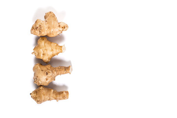 Jerusalem artichoke tubers isoalted on a white. Jerusalem artichokes with copy space.