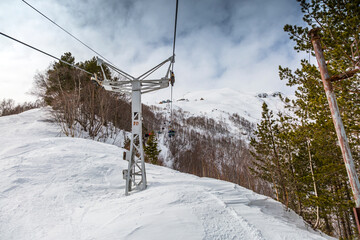 Fototapeta na wymiar Lift for skiers to the mountain peak. North Caucasus, Kabardino-Balkaria, Elbrus, Russia.