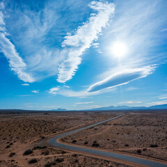 Aerial View of a desert road - Lenticular Clouds