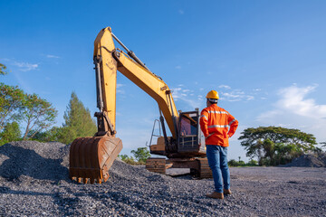 Driver excavator for road construction, Crawler excavator in construction site on blue sky...