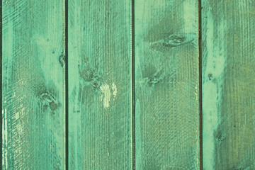 Wooden background with green colored planks 