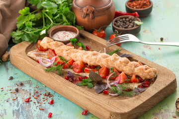 Minced Lula kebab grilled turkey chicken on wooden board