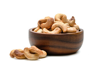 Roasted cashew nuts in wooden bowl isolated on white background