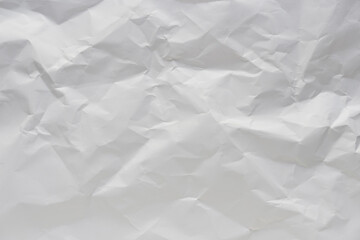 White crumpled paper texture background.