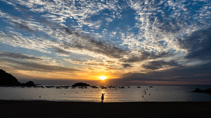 Sunrise on the bay of Tossa de mar, Spain, rising of the sun on the beach in Costa Brava