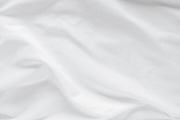 Abstract white fabric texture background. Cloth soft wave. Creases of satin, silk, and cotton.