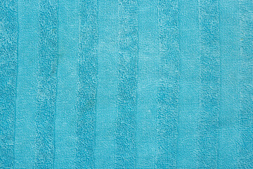 Terry towel texture. Soft cotton fabric towel texture. Detail of textured bath towel. Turquoise towel. 