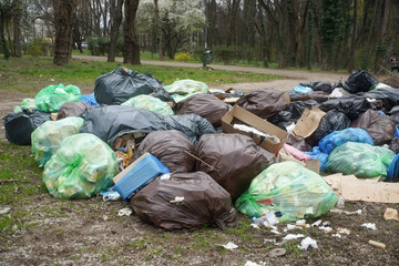 Fototapeta na wymiar Garbage not picked up in Herastrau Park, Bucharest, Romania.