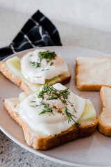 a plate of toast with fried eggs
