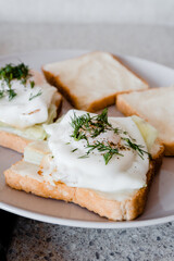a plate of toast with fried eggs
