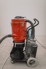 Industrial vacuum cleaner used on site attachable to the grinder