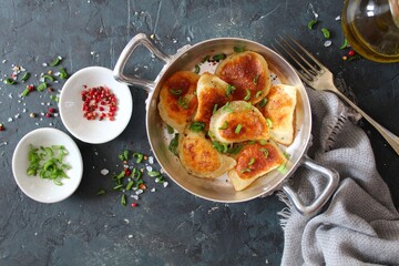 Homemade fried ravioli. Fried polish potato pierogis. Top view with copy space. Vegetarian and vegan food.