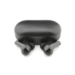 In-ear headphones. Black wireless earphones in-ear with charging case. Wireless earbuds or earphones on white background. 