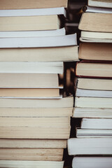 Close-up of a stack of books on shelf