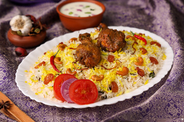 Chicken biryani Spicy Indian Malabar biryani Hyderabadi biryani, Dum Biriyani pulao golden bowl Kerala India Sri Lanka Pakistan basmati rice mixed rice dish with meat curry Ramadan Kareem, Eid