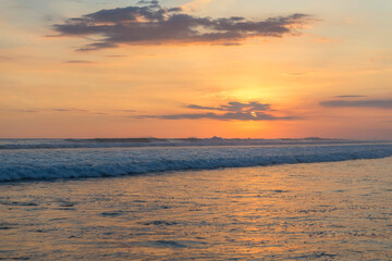 Fototapeta na wymiar Beautiful sunset sky on the beach in Matapalo, Costa Rica. Central America. Sky background on sunset. Tropical sea.