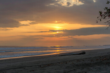 Fototapeta premium Beautiful sunset sky on the beach in Matapalo, Costa Rica. Central America. Sky background on sunset. Tropical sea.