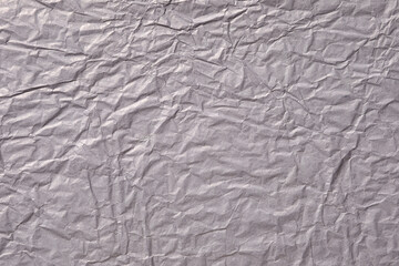 Dark purple crumpled paper background texture
