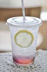 lemon soda or tonic, soda and lime slice